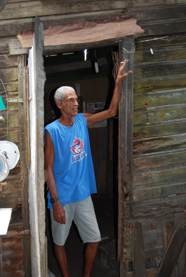 Man at door of humble abode in Bluefields, Nicaragua